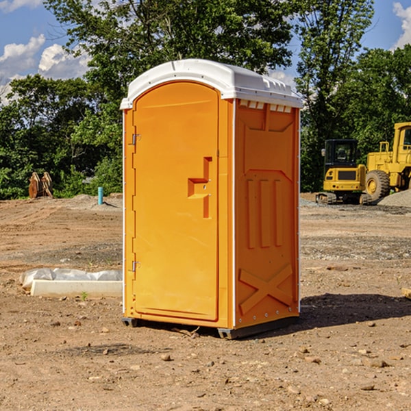 what is the cost difference between standard and deluxe portable toilet rentals in Rushford Village